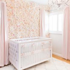 White Upholstered Crib, Silk Flower Wall, and Chandelier