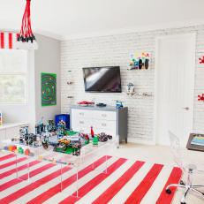 Boy's Red and White LEGO-Themed Playroom With Play Table