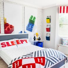 Boy's Blue and White Bed With Custom Pillow in LEGO Room