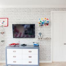 White Playroom With Brick Wall and Magnetic Wall Board