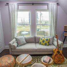 Eclectic Purple Bonus Room with Gray Sofa 
