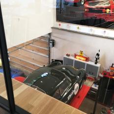 View From Upper Residence Area Into High-End Garage Space