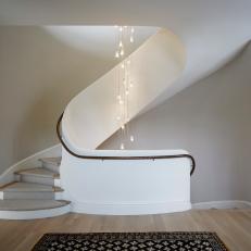 Modern Spiral Staircase With Black Railing