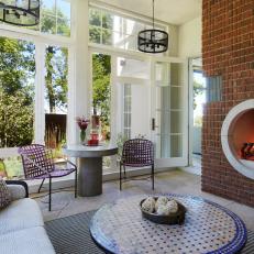Porch Sitting Room With Round Fireplace