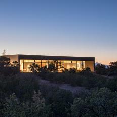 Concrete Home in Santa Fe Desert Casts Silhouette at Sunset