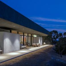 Modern Patio With Overhang at Sundial House During Evening