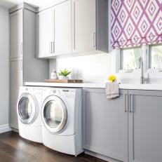 Metropolitan Living Laundry Room With Dark Hardwood Flooring