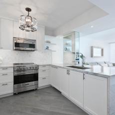 White Open Plan Small Kitchen With Chandelier