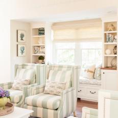 Coastal Living Room With Window Seat and Striped Armchairs