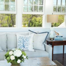 Seaside Cottage Living Room With White Sofa and Rustic Table