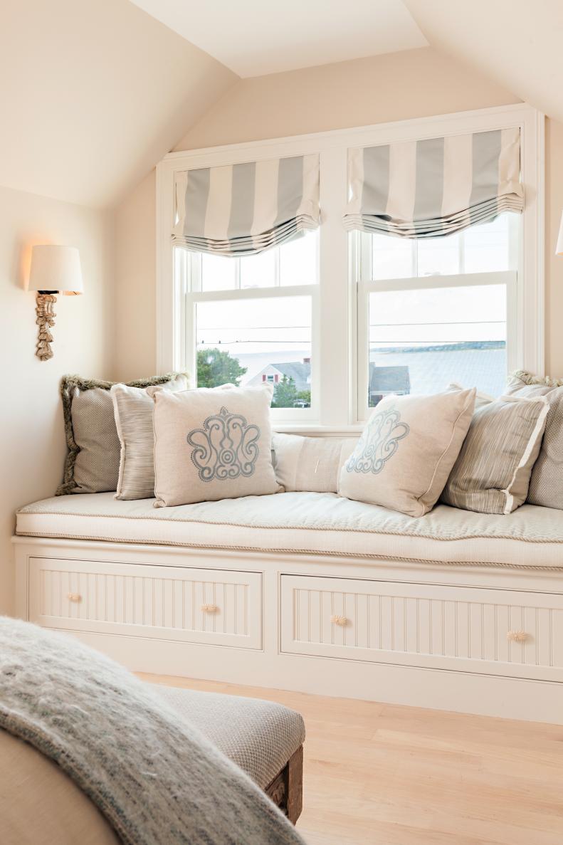 Guest Cottage Neutral Window Seat With Light-Blue Accents