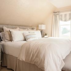 Neutral Bedroom With King Bed and Upholstered Headboard