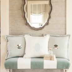 Cottage Sitting Area With Striped Bench and Arabesque Mirror