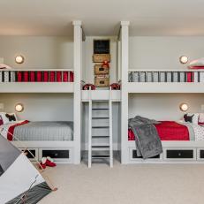 Bedroom With Four Built-In Bunk Beds and Central Ladder