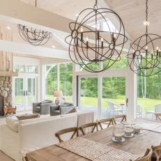 Cottage Dining Area With Globe Chandeliers
