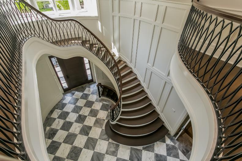 Entrance Foyer With Curved Staircase & Checkerboard Marble Tile Floor