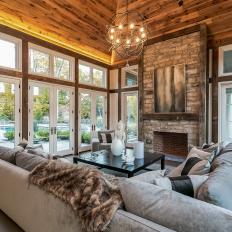 Family Room With Barnwood Ceiling and Stone-Veneer Fireplace