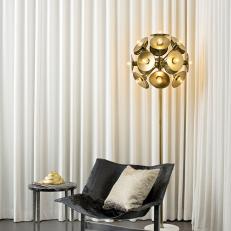 Luxe Living Space Includes Black Chair, Gold Floor Lamp