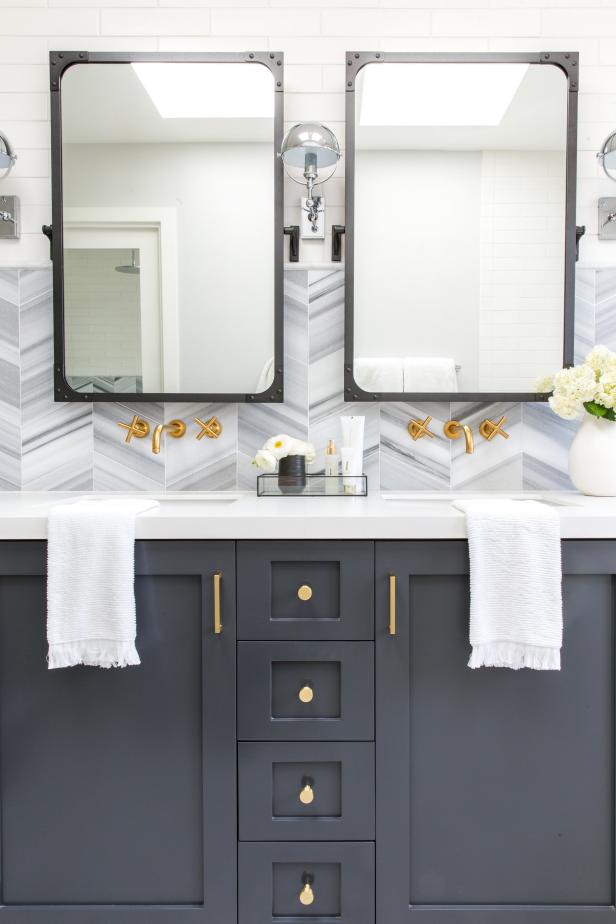Blue and Gray Bathroom Wall and Vanity With Brass Faucets and Hardware