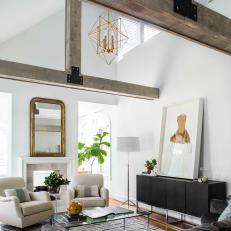 White Living Room With Exposed Beams and Gray Furnishings