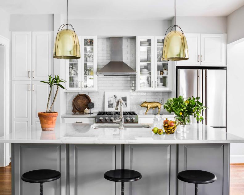 White-and-Gray Kitchen With Gold Metallic Pendant Lights Over Bar