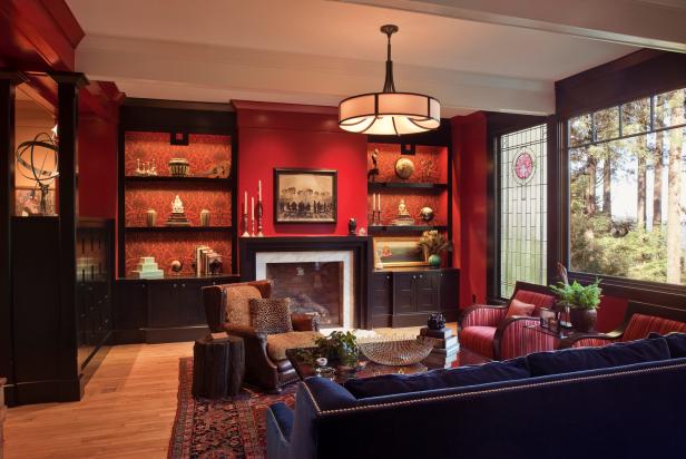 Red Living Room With Navy Blue Sofa And Stained Glass Window