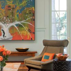 Seating Area With Midcentury-Modern Chair and Large Painting