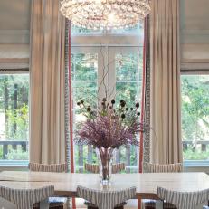 Dining Room With Crystal Chandelier and Zebra-Striped Chairs