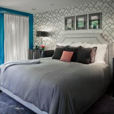 Bedroom With Silver Wallpaper and Bright Teal Wall