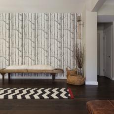 Transitional Foyer With Tree-Pattern Wallpaper & Chevron Rug