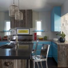 Kitchen With Blue and Barnwood Cabinets, Hood, and Island