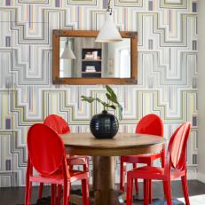 Dining Room With Geometric Wallpaper and Black Cowhide Rug