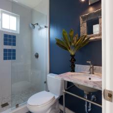 Navy-Blue Bathroom With Mosaic Tile Floor in Shades of Blue