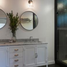Bathroom With Vintage White Double Vanity & Black Tile Floor