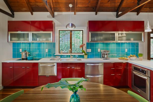 Kitchen With Red Cabinets and Turquoise Tile Backsplash | HGTV