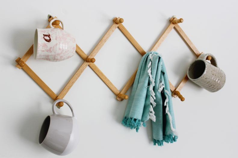 Coffee Mugs and Tea Towel Hanging on Peg Rack