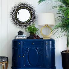 Blue Cabinet and Gold Lamp