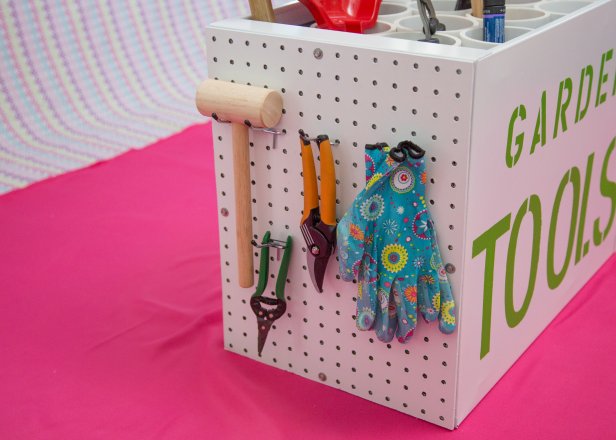 Hang tools to the pegboard on the side of the storage rack.