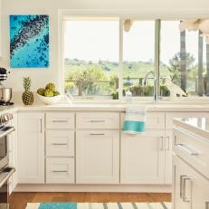 White Kitchen With Blue Art