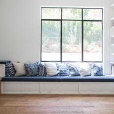 Blue and White Window Bench With Throw Pillows