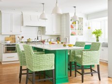 White Kitchen With Green Island and Chairs