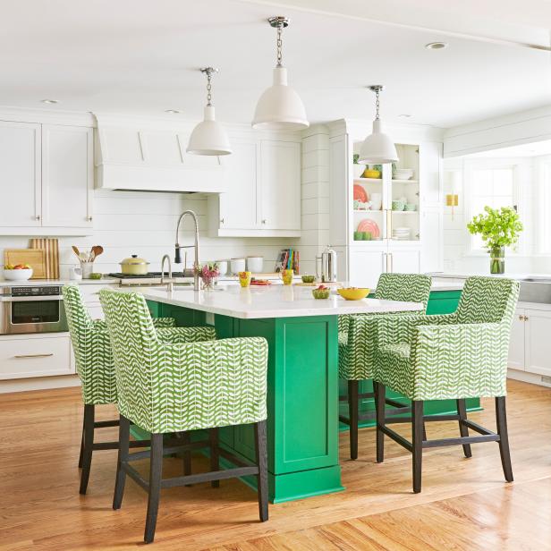 White Kitchen With Green Island and Chairs