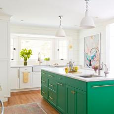 White Kitchen With Shiplap Walls and Large Green Island