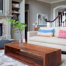 Transitional Living Room Featuring Cowhide Rug, Neutral Sofa and Custom Coffee Table 
