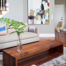 Transitional Living Room With Custom Walnut Coffee Table and Neutral Color Scheme 