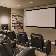 Home Theater With Black Armchairs