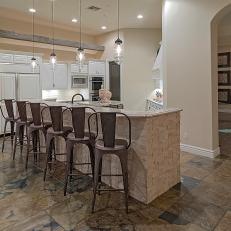 Neutral Open Kitchen With Arched Doorway