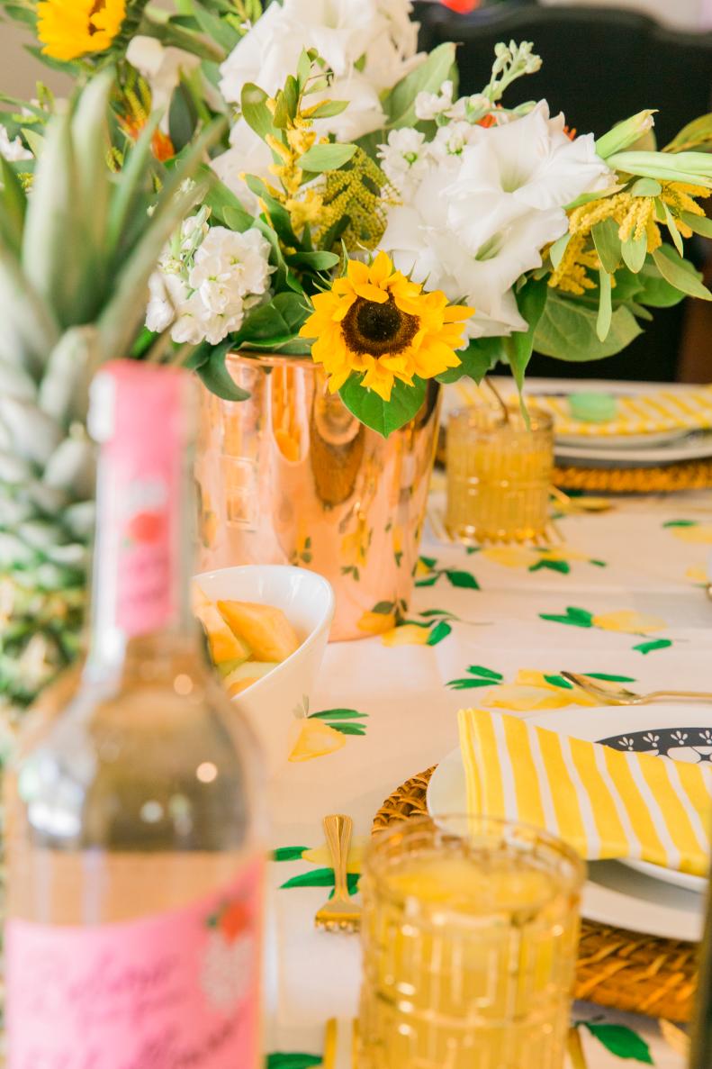 Sunflowers are a fun way to enhance a casual floral arrangement. For even more fun, invite a local floral designer to teach a workshop to your guests, and if you don’t have the budget for a florist, select an online video to watch with your friends. 
