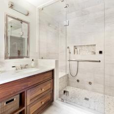 White Marble Master Bathroom With Walnut Vanity