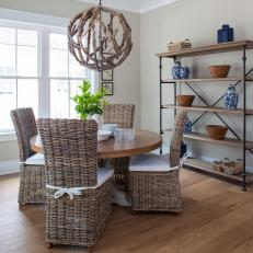 Dining Area With Wicker Chairs and Driftwood Ball Pendant
